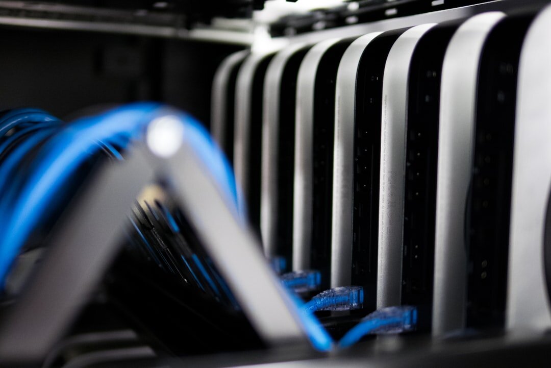 Row of server racks in modern data center with blue lighting