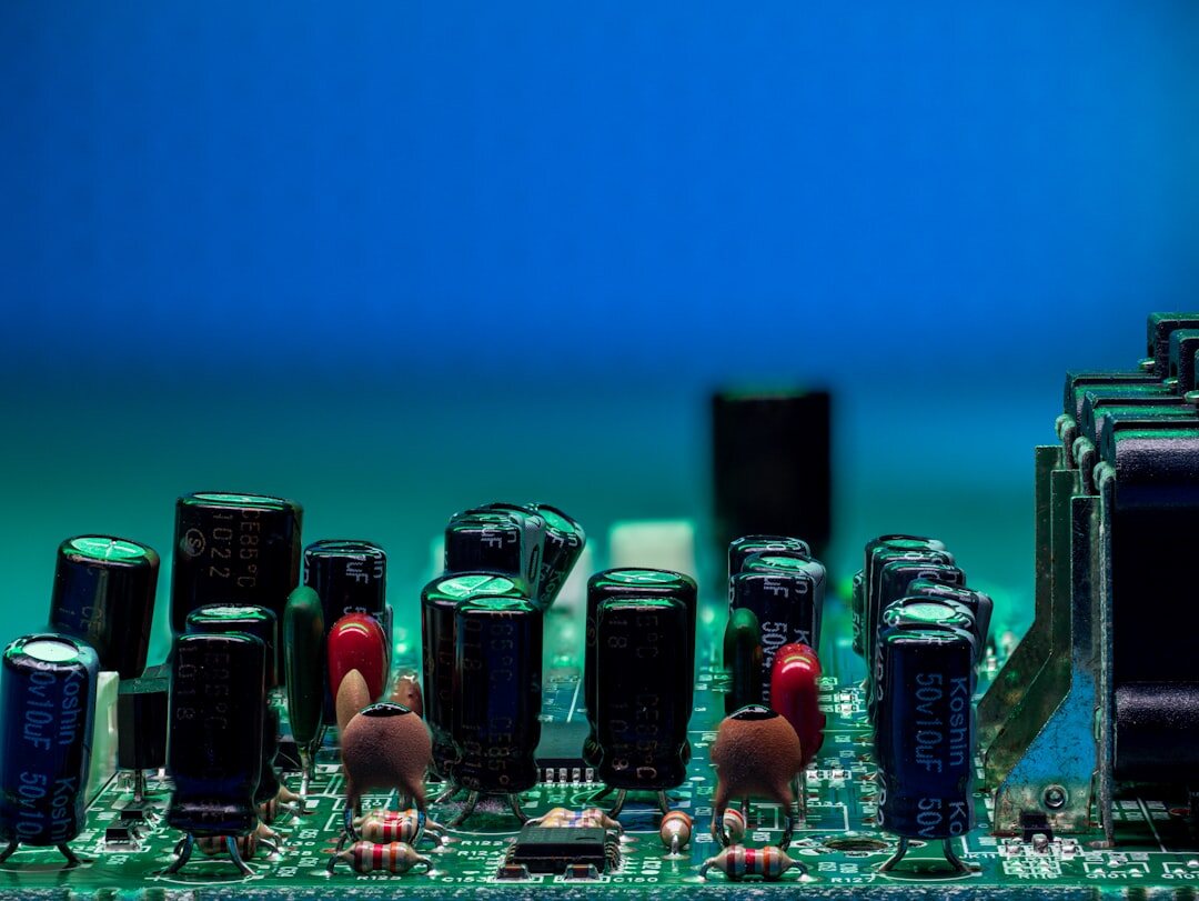Close-up of glowing blue circuit board with electronic components